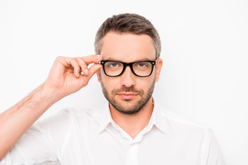 Fototapeta na wymiar Attractive smart successful man touching his eyewear
