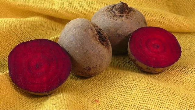 Fresh beetroot  isolated on yellow background 
