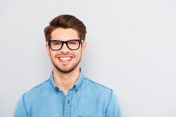 Portrait of handsome cheerful young smiling man in glasses