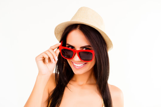 Portrait of cheerful happy woman in summer hat and glasses