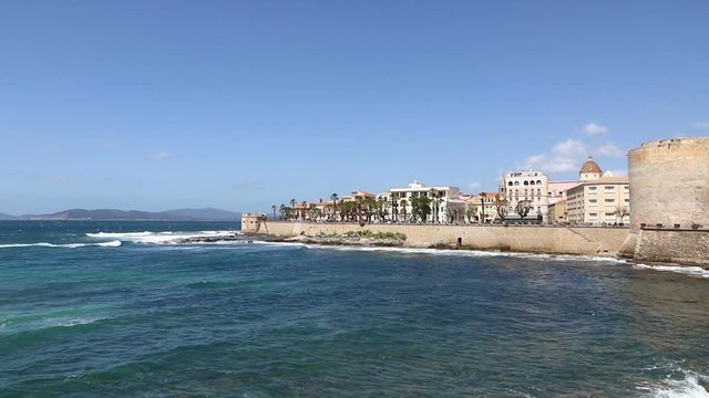 Windy day at rocky seacoast in Alghero city, Sardinia island, Italy