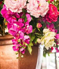 Delicate beautiful bouquet of roses, orchid and other flowers. Closeup.