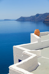 A perfect view of the volcano in Oia, Santorini with blue waters of the sea