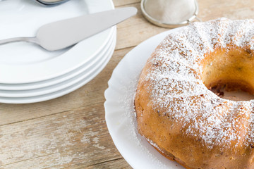 Bundt cake on white plate, ready to serve