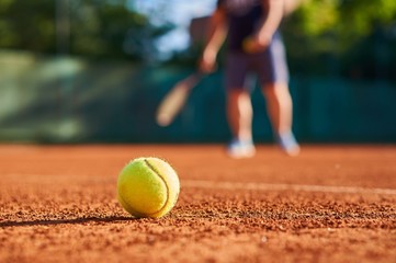 Tennis ball with blurred background.