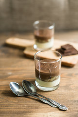 three-layered mousse dessert : chocolate , banana and vanilla