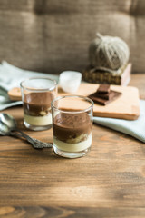 three-layered mousse dessert : chocolate , banana and vanilla