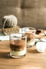 three-layered mousse dessert : chocolate , banana and vanilla
