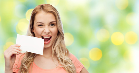 happy woman or teen girl with blank white paper