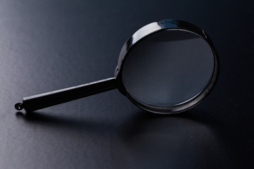 magnifying glass on dark background