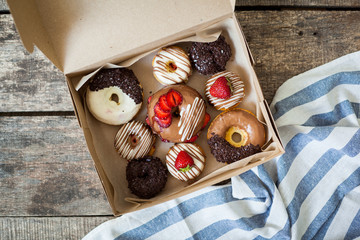 Colorful donuts in box