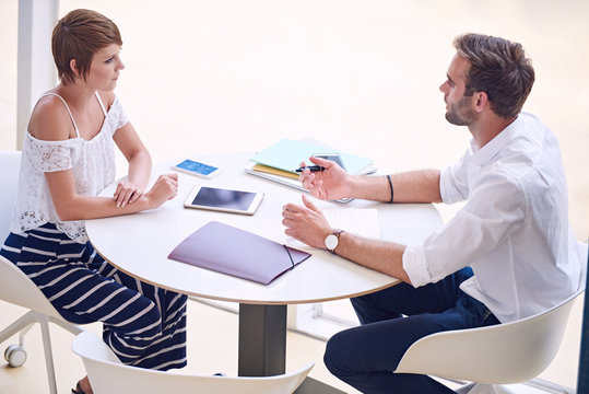 Professional Consultant Giving Business Advise To Aspirational Businesswoman