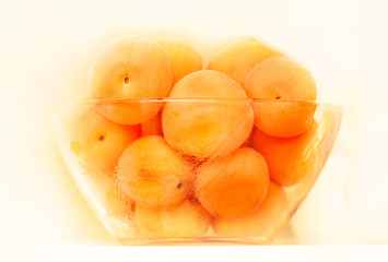 Apricots in glass bowl