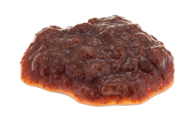 Blob of wild strawberry preserves on a white background