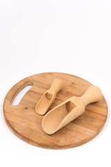 Wooden measuring scoops on the wooden kitchen board
