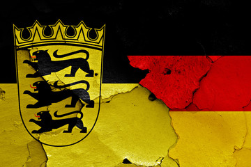 flags of Baden Wurttemberg and Germany painted on cracked wall