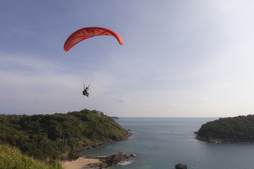 paraglider above a sea in Puket, Thailand.