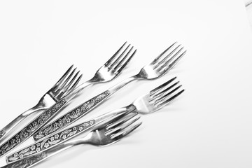 Old metal forks isolated on a white background.