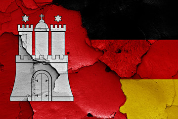 flags of Hamburg and Germany painted on cracked wall
