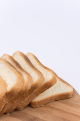 Toast bread isolated over white on the cutting board