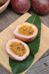 Ripe passion fruit is delicious on wood background.