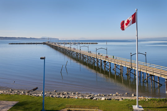 White Rock Pier BC, Canada. White Rock and it's pier is a popular tourist destination on the west coast of British Columbia near the United States border.

