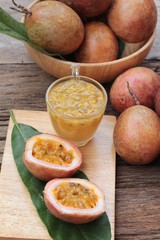 Passion fruit smoothie is delicious on wood background.