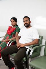 Fototapeta na wymiar .Hindu couple sitting in the waiting room