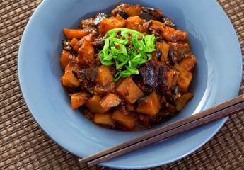 Asian vegetarian meal with potatoes and eggplants. Close up