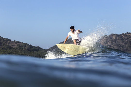 Indonesia, Sumbawa island, Surfer