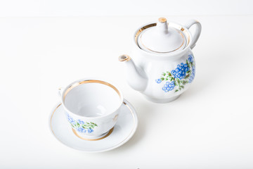 Cup of tea with teapot in vintage style