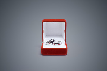 wedding rings on a wooden table