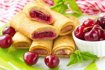 Pancakes with fresh cherries