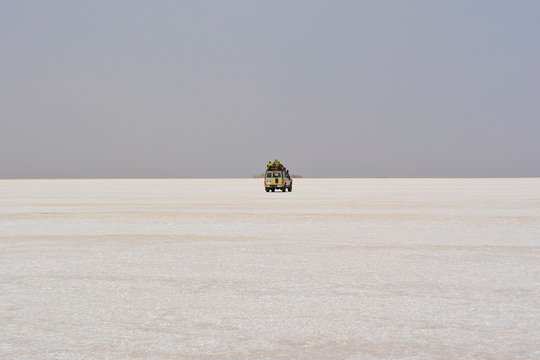 Jeep crossing salty desert, Ethiopia