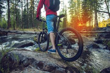 Fototapeta na wymiar Ride on mountain bike at sunset.