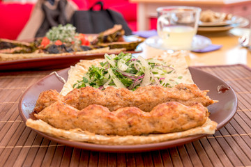 Kebab with green salad leaves