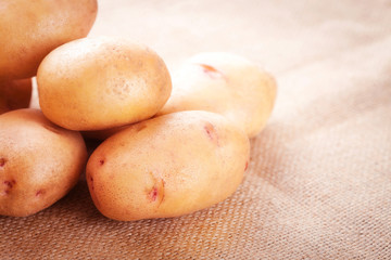 Potato tubers on a table close-up