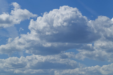 White clouds in the blue sky, sunshine