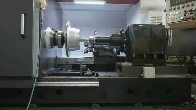 Metal Spinning machine shaping a peace of metal