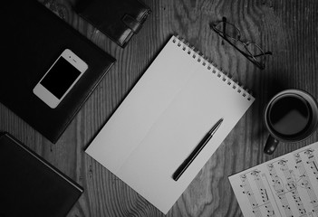 Fototapeta premium monochrome notebook paper writing tools