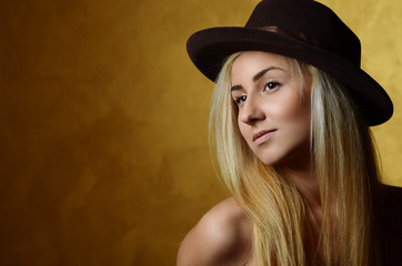 Portrait of beautiful blonde girl in hat