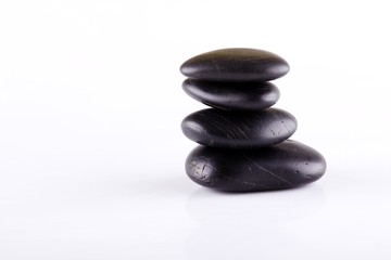Few black lava stones stacked at each other