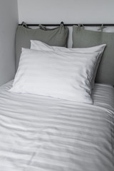 Fototapeta na wymiar white Pillow, Bedding sheets and pillows up white bedding stripe