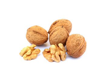 Fresh walnuts with a shell isolated on white background