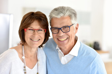 Portrait of smiling senior couple at home