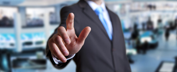 Young man on office background