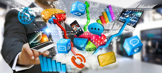 Businessman holding tech devices and charts in his hand