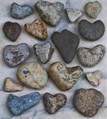 Collection of Natural Heart Rocks/Collection of natural heart rocks on marble stone slab