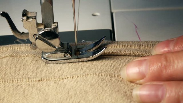 Close up Video of Sewing Machine  - Sew A Dress In A Textile Factory. Slow Motion Full Hd Stock Footage Clip.
