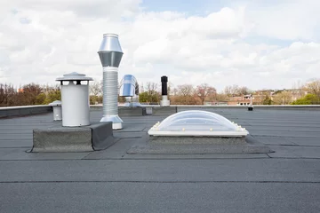 Photo sur Plexiglas Bâtiment industriel Cheminée sur le toit